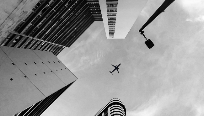 Aeroplane flying over city
