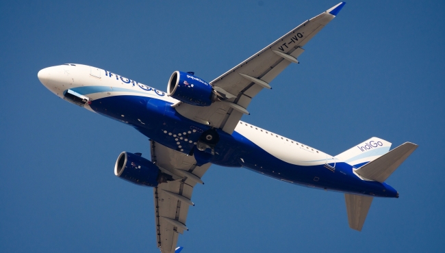 An Airbus A320 NEO aircraft in flight, operated by IndiGo airlines.